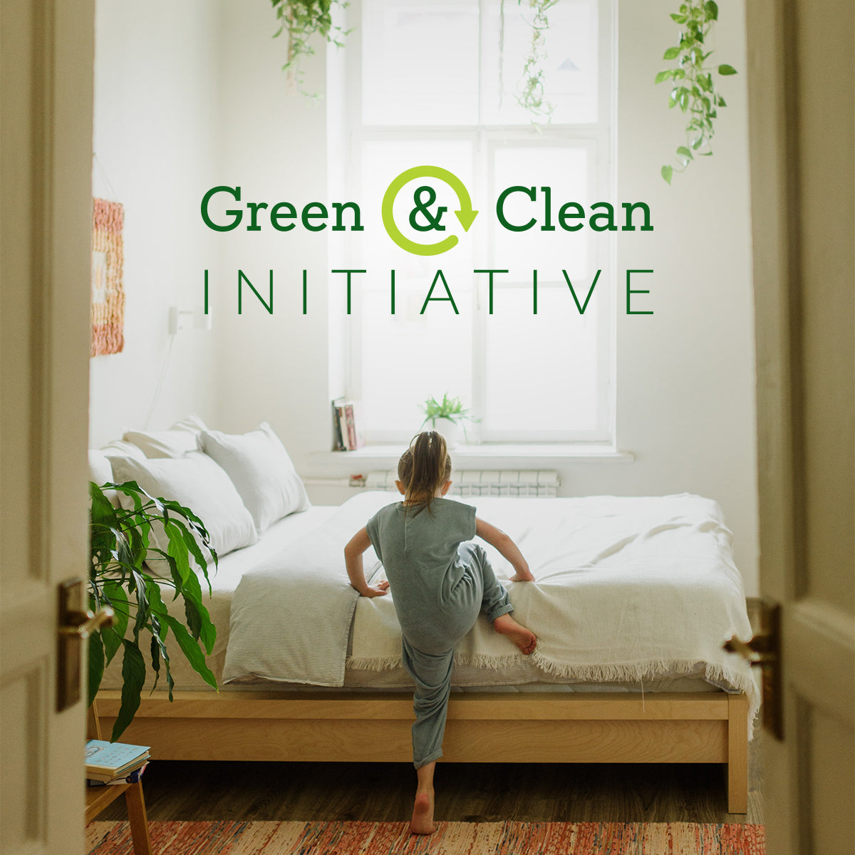Green & Clean Initiative logo on top of photo of young girl climbing into bed