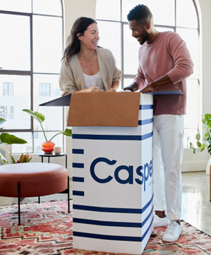 Couple opening a Casper mattress box