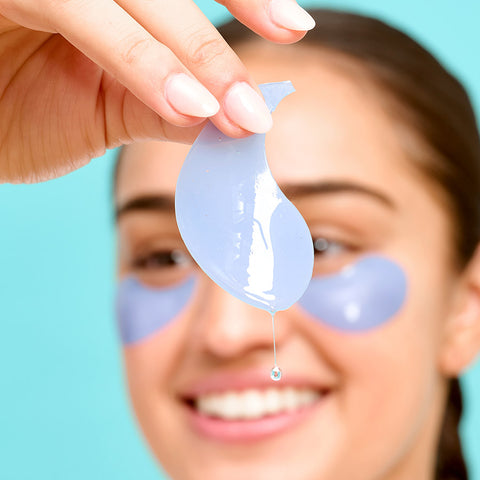 woman holding eye patch on ice