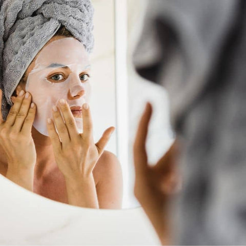 why is hydration important to your skin? woman wearing sheet mask