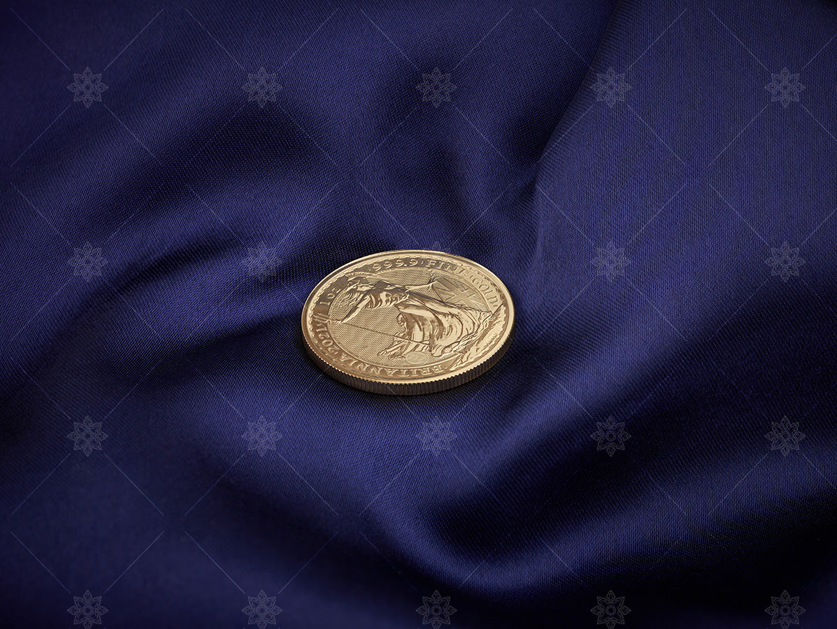 Gold Bullion coin on blue silk