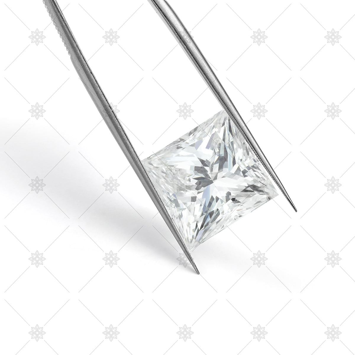 Princess cut Diamond held in Tweezers