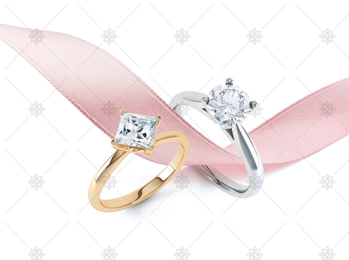 Diamond rings with pink ribbon stock image