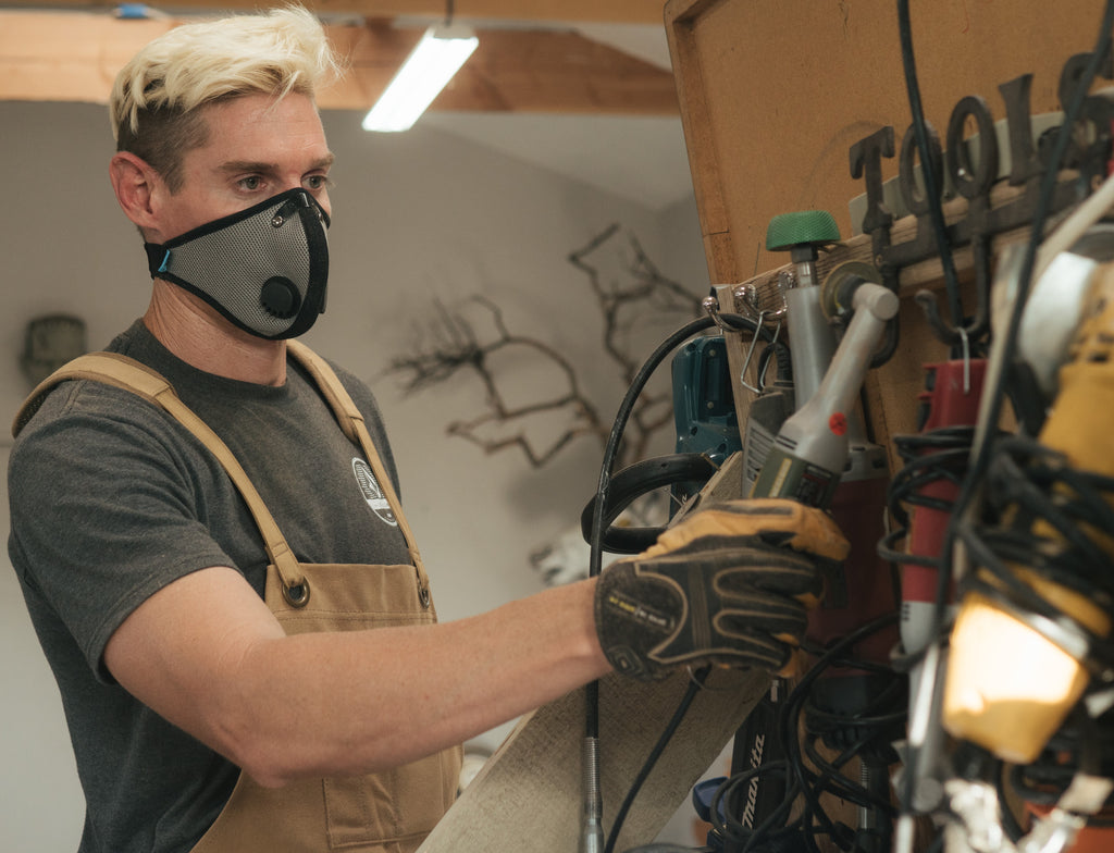 cory hamilton wearing rz mask looking at tools
