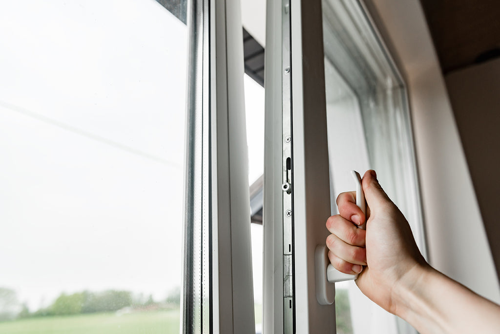 Handing closing window to prevent smoke from getting into home.