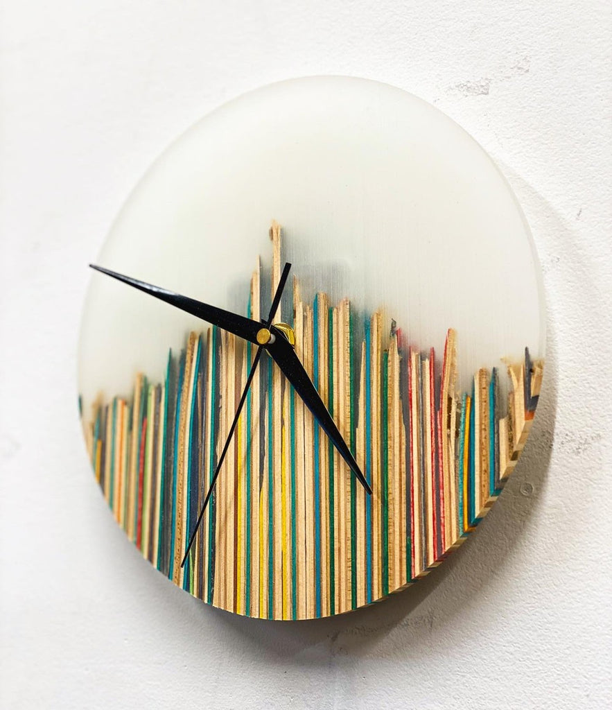 White analog clock designed by Woby