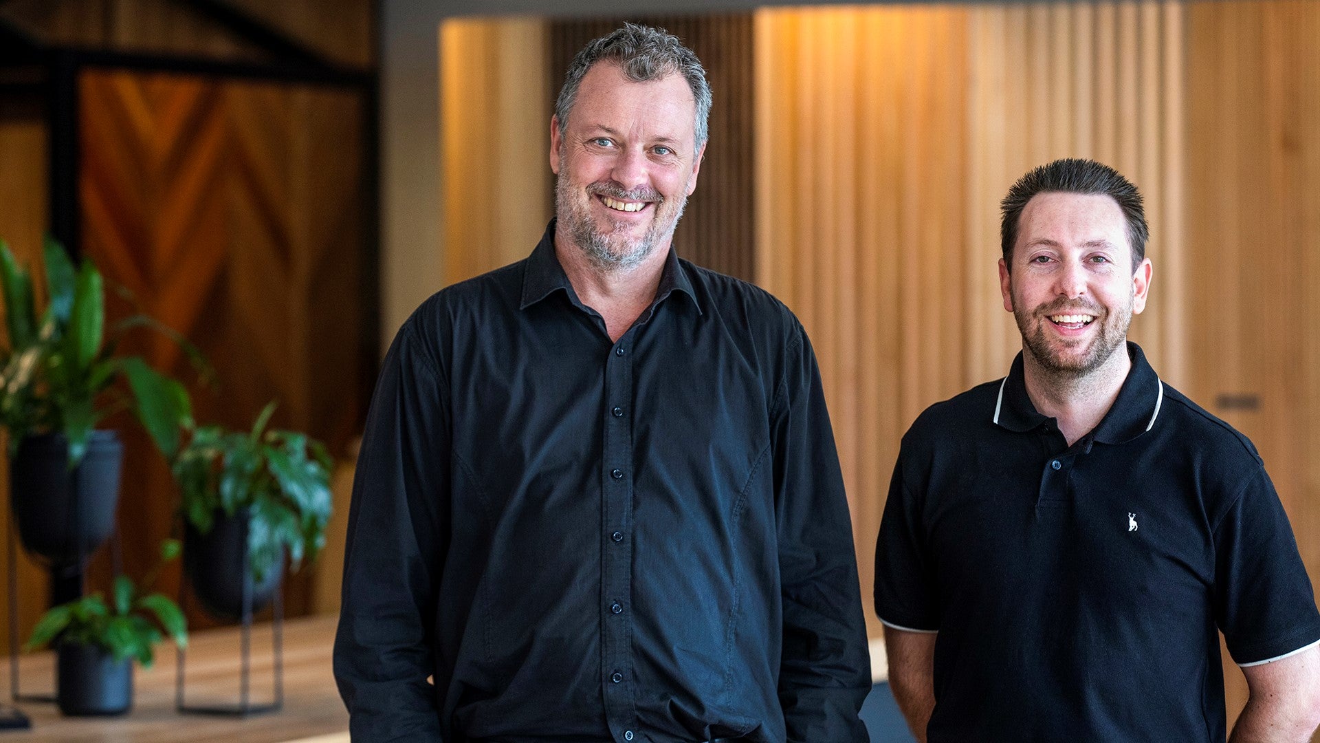 Two Melbourne showroom staff smiling