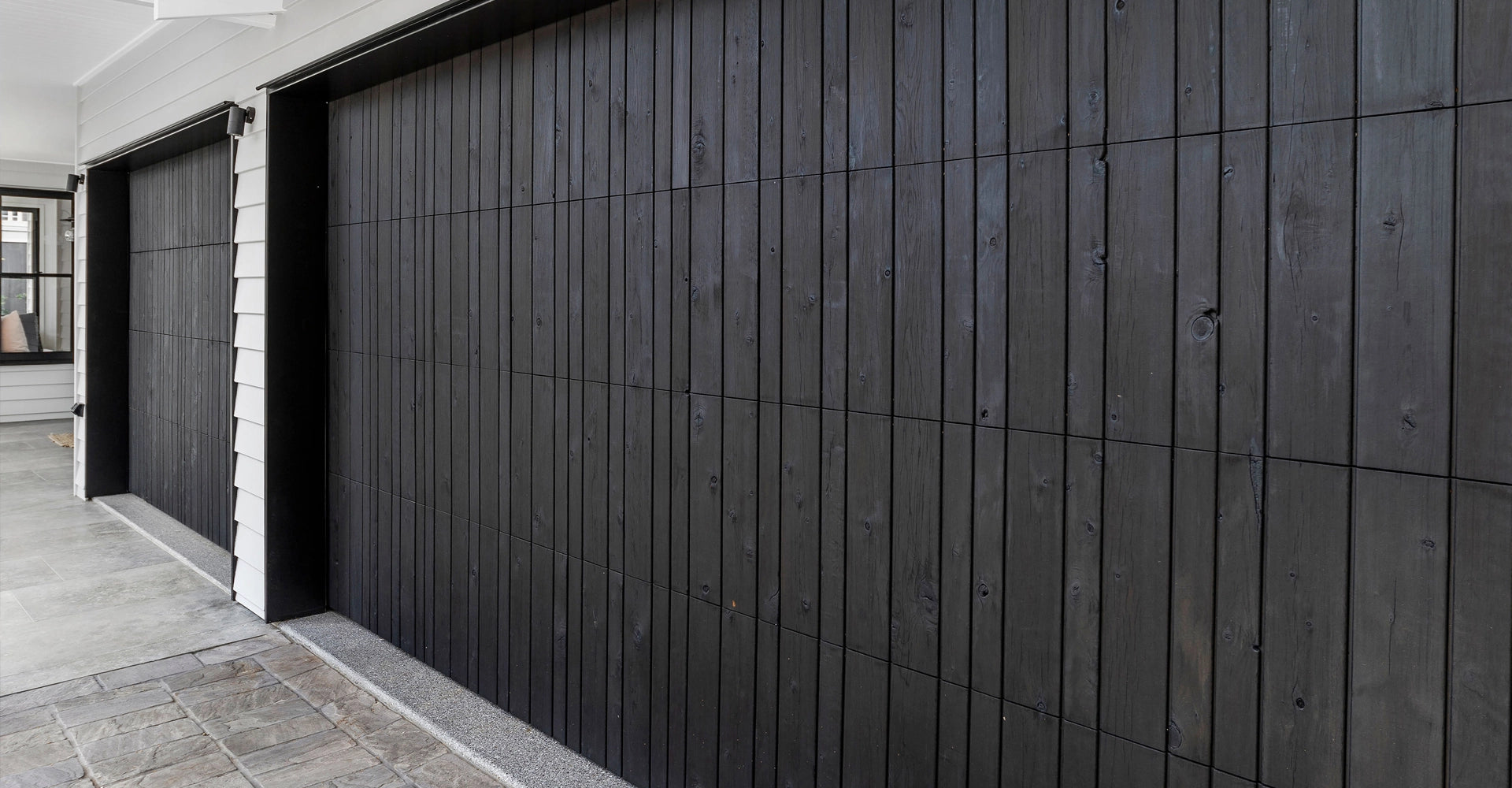 Hurfords Shou Sugi Ban cladding on garage doors