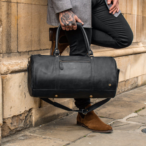 branded leather duffle bag