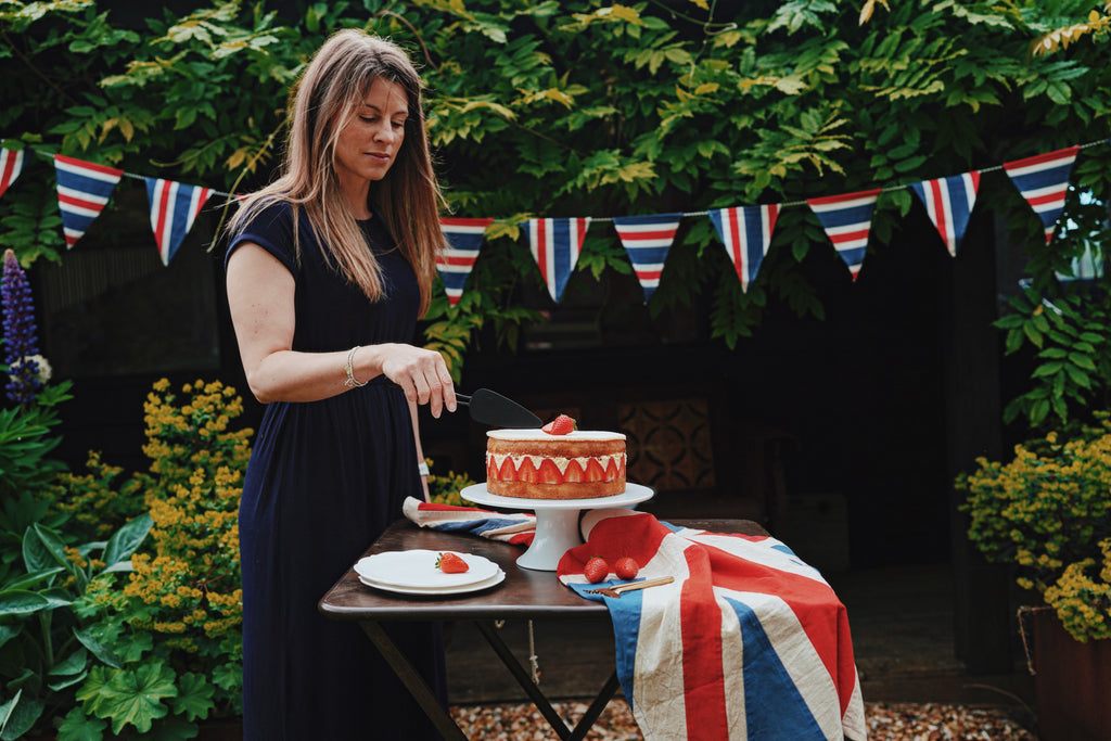 Jane Lewis cutting Jubilee cake