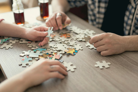 Couple completing a puzzle