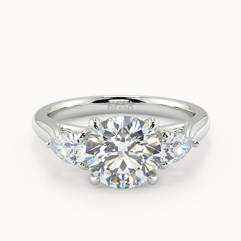 Cassina trilogy engagement ring image, round centre diamond and pear sides
