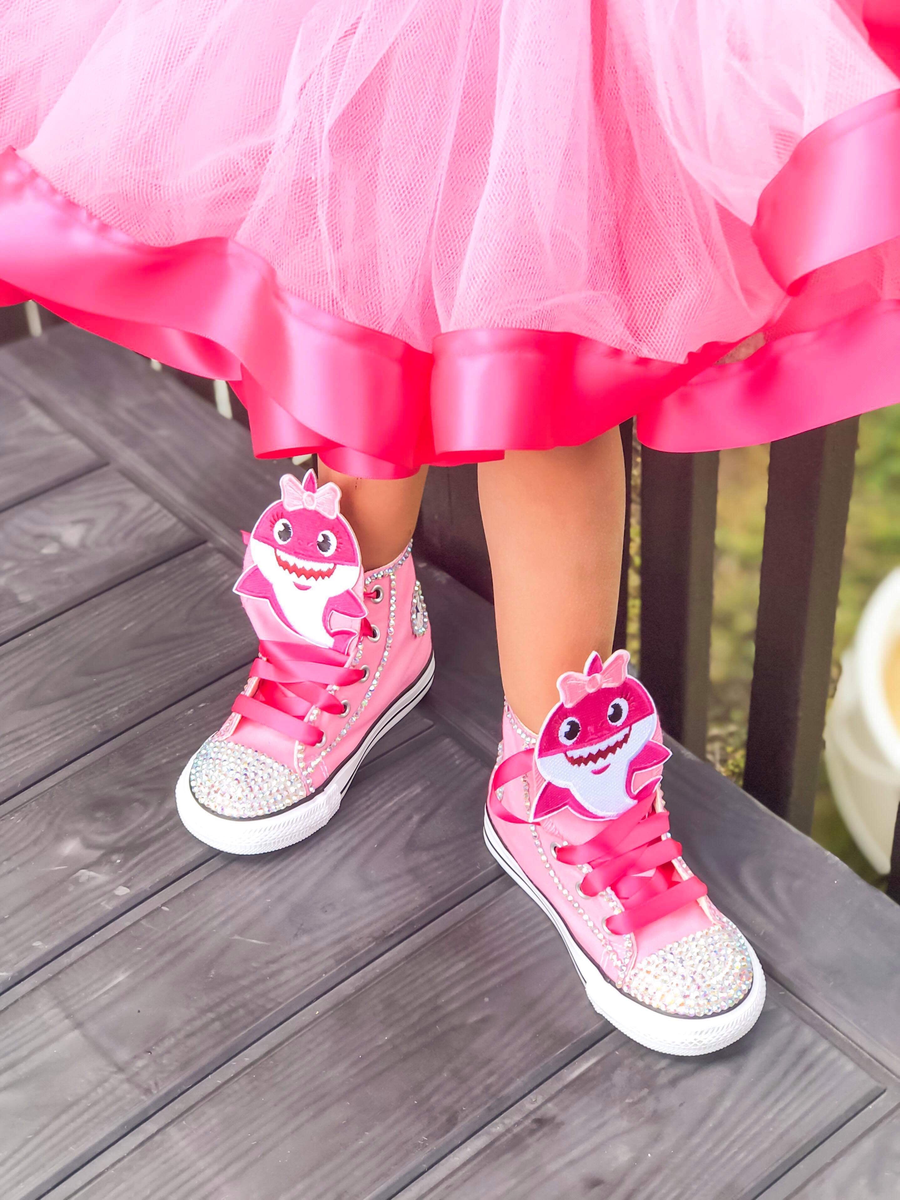 baby girl wearing converse shoes