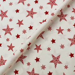 cream and red star print christmas fabric