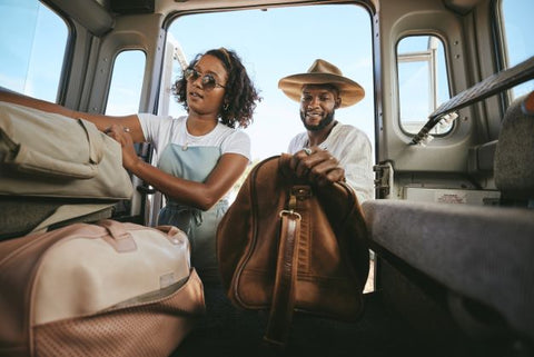 Couple packing for a road trip