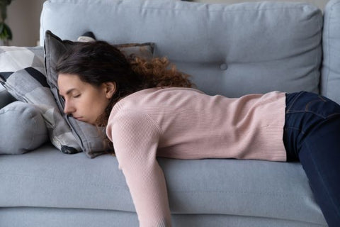 Woman asleep on couch