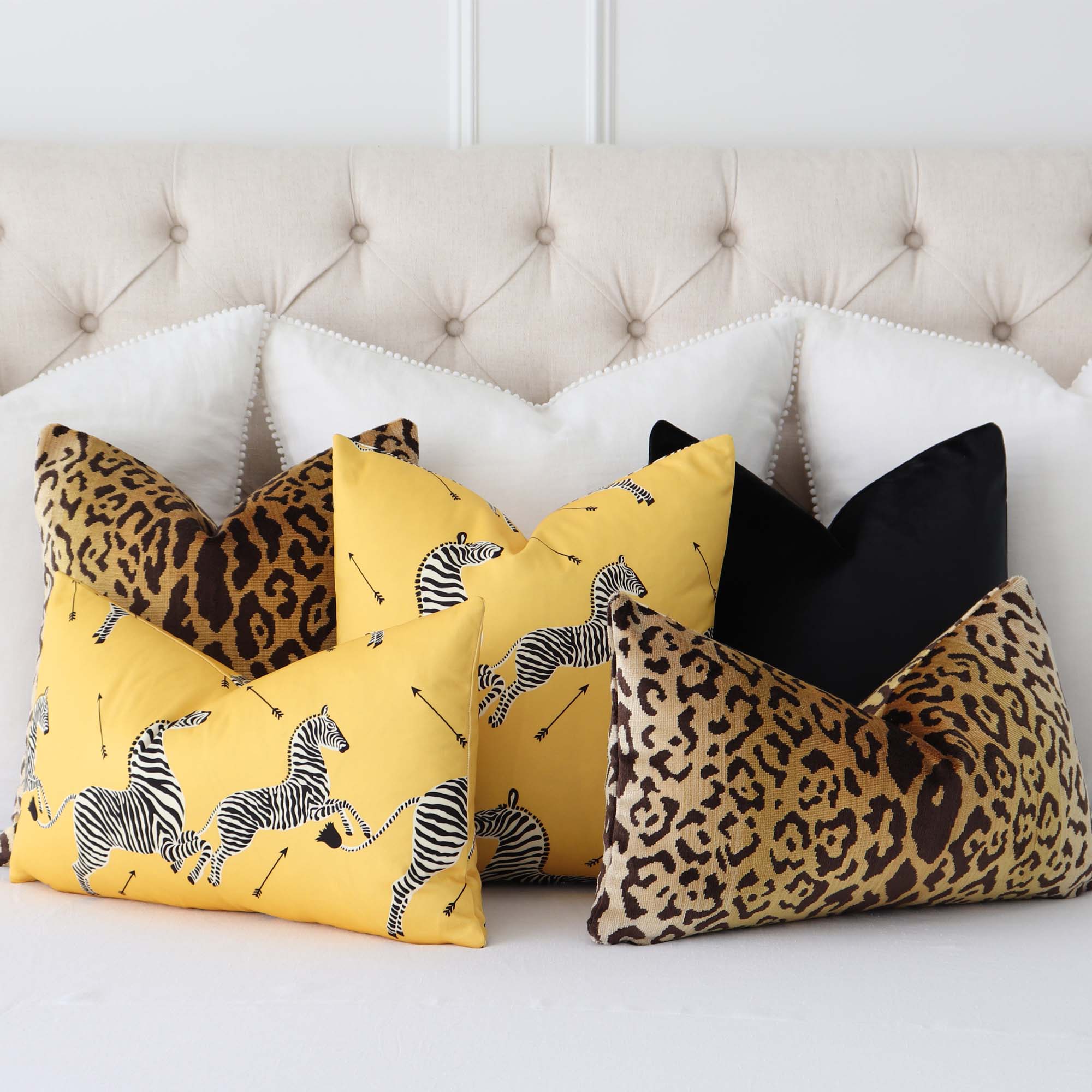 https://cdn.shopify.com/s/files/1/1116/9186/products/scalamandre-zebras-petite-yellow-SC000316641-designer-animal-print-throw-pillow-cover-with-coordinating-throw-pillows-on-bed_2000x.jpg?v=1675910125