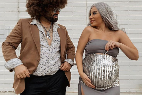 ic:Mom's baby bump with dad dressed as disco ball