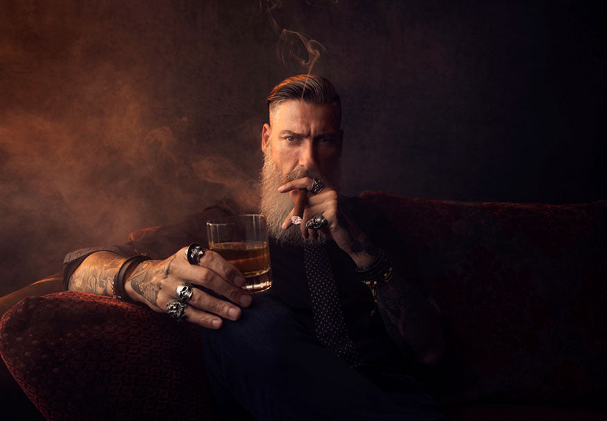 cigar smoking man with rings