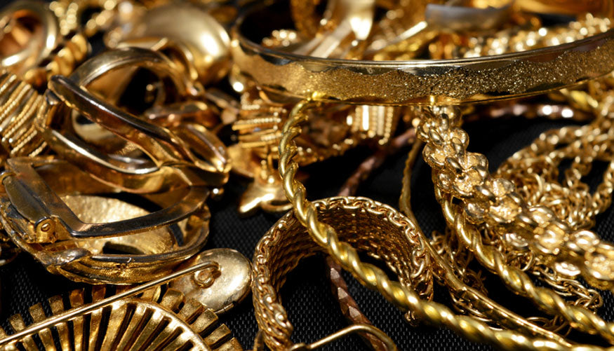 a pile of gold jewelry