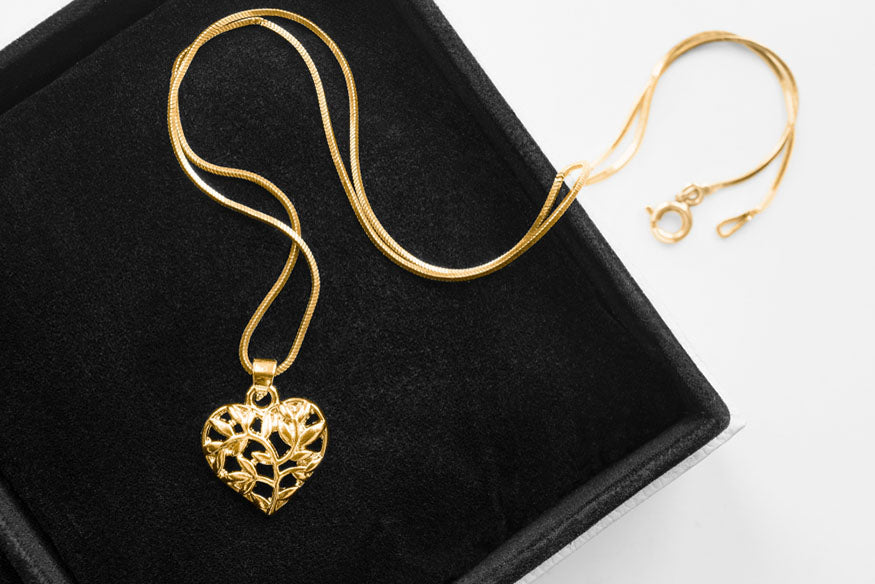 gold necklace carved heart