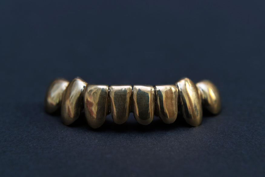 golden grill for teeth isolated