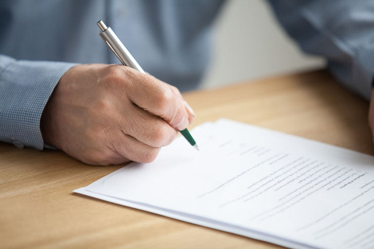 hand signing business document