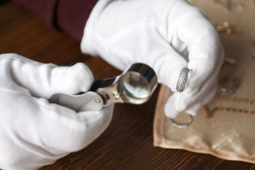 jeweler inspecting ring