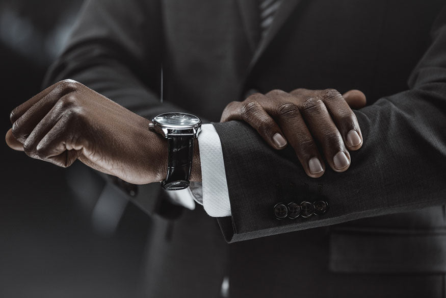 man checking wrist watch