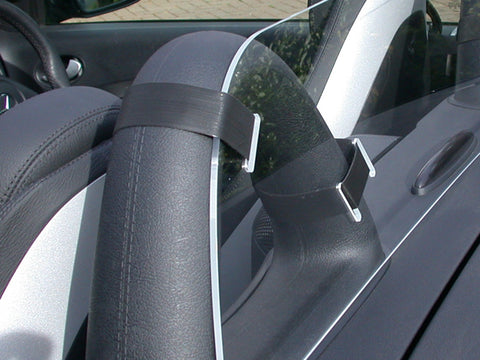 Clear Perspex Wind Deflector, with black Velcro straps fitted to a standard black roll bar