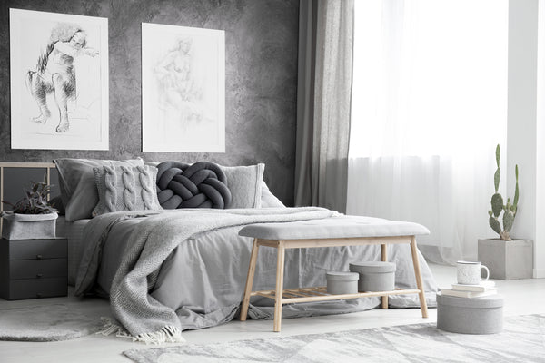 Eclectic bedding trends mixing innovative designs and eco-friendly choices in a monochromatic bedroom