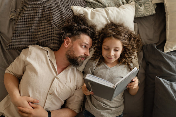 reading-books-in-bed-bedtime-stories-quality-family-time-get-another-mattress-sale-moms-and-dads