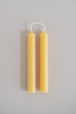 A pair of naturel beeswax tube candles