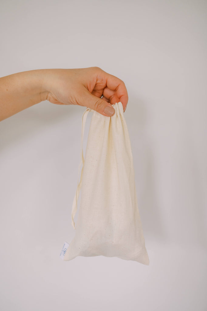 A hand holding cotton bulk bag