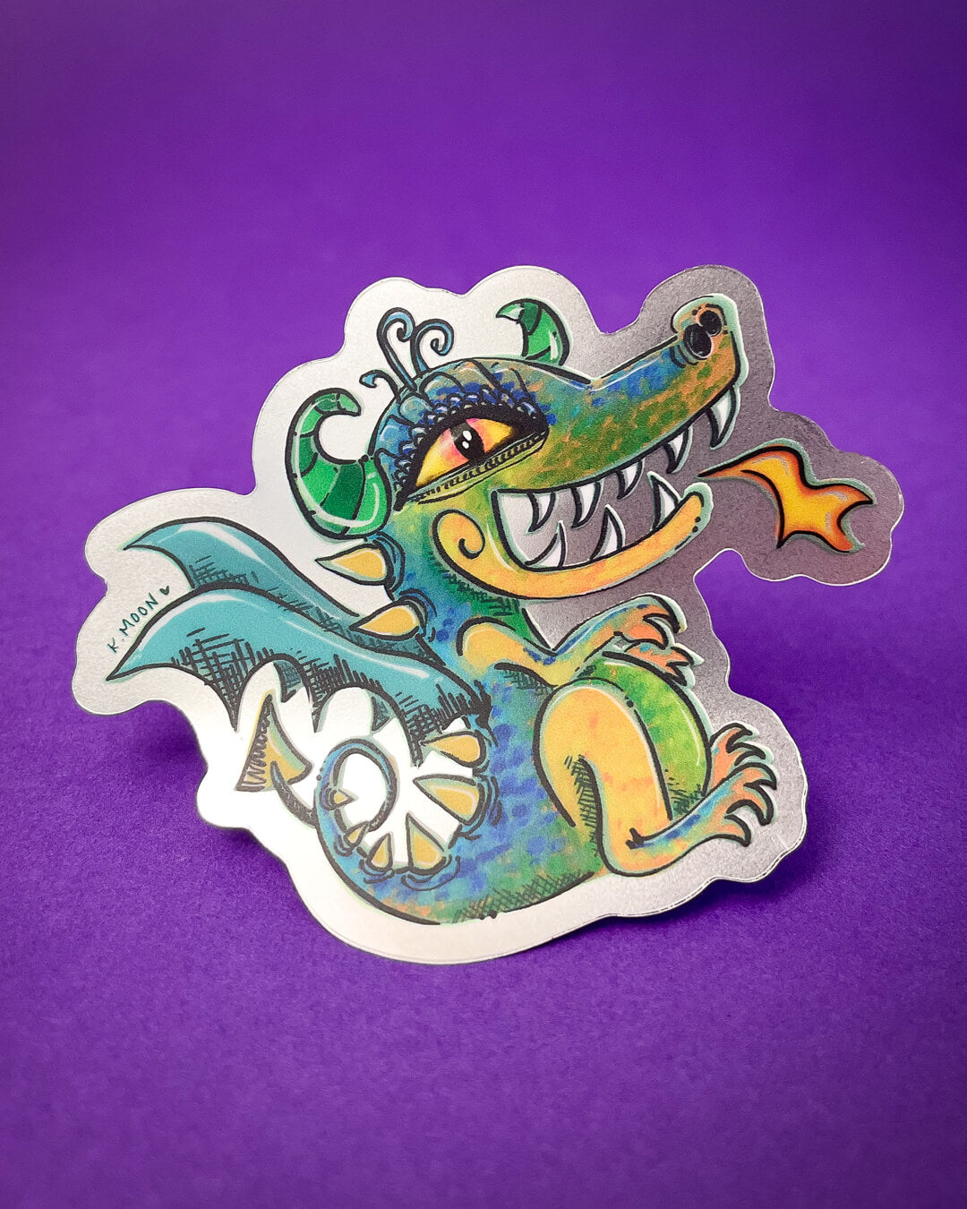A dragon smiling and breathing fire artwork This is a Custom Phantom Sticker Printed by Rockin Monkey