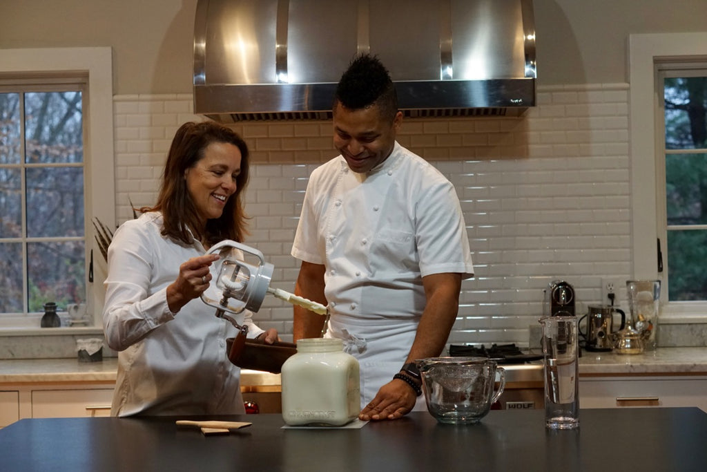 Kristin and Chef Marlon making butter with Churncraft butter churn
