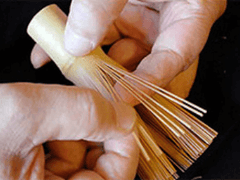 Hand separating thick and thin weight tines of a bamboo whisk