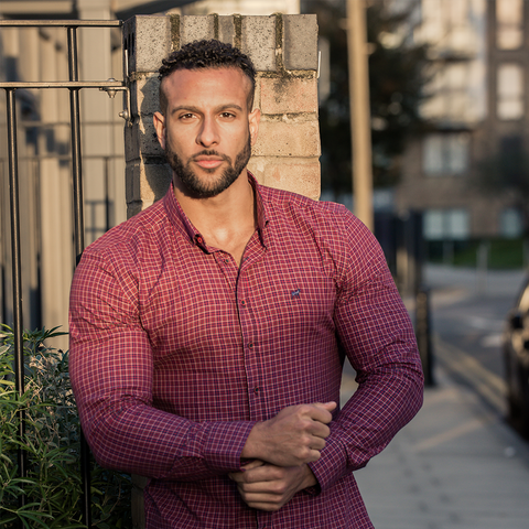 Professional Bodybuilder Romane lanceford in red chequered shirt made for men with big muscles