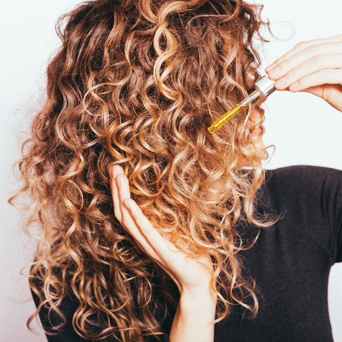 Women Using Argan Oil for Curly Hair - Moroccan Elixir