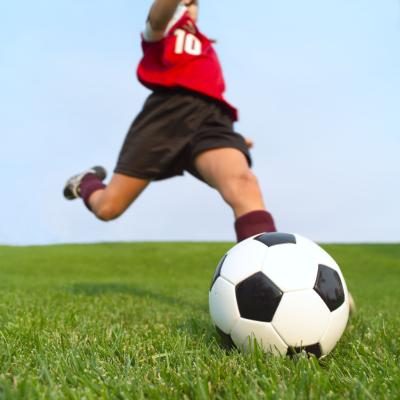 Soccer player kicking ball