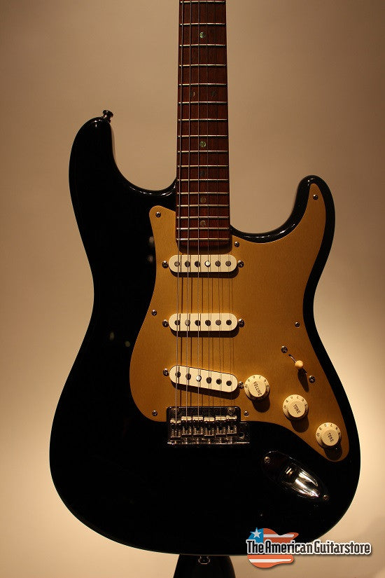 black strat with gold pickguard