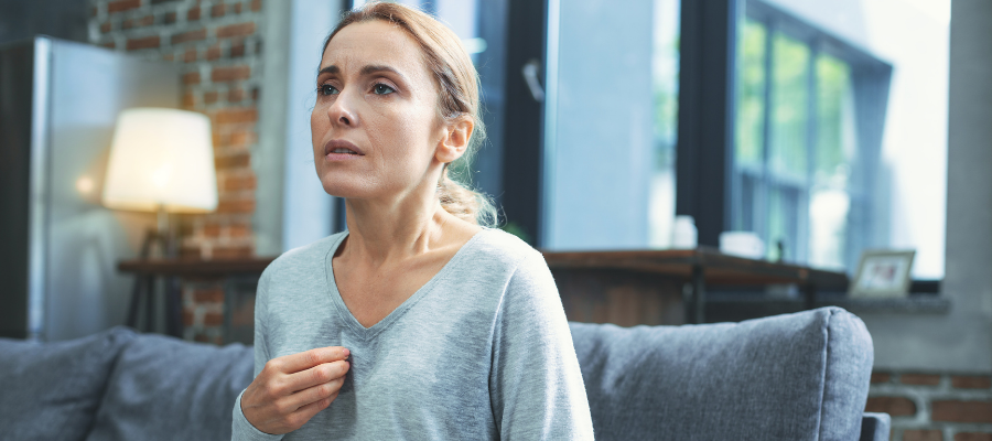 Woman having anxiety attack, Eargasm Earplugs, Menieres