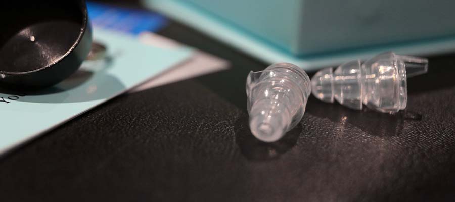 Transparent earplugs are laying on the table