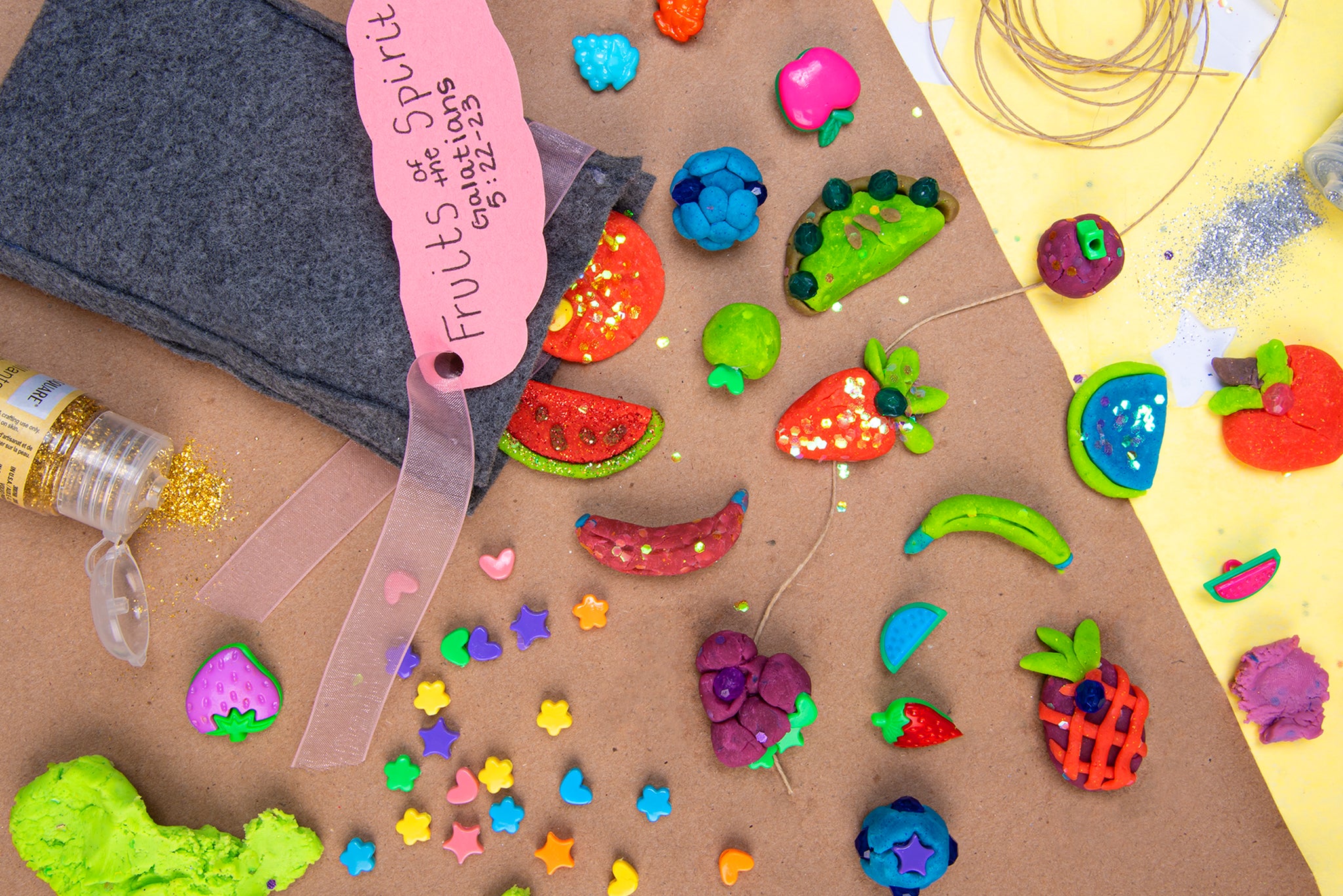 Cute closeup image of colorful, embellished fruit charms made with homemade air dry clay