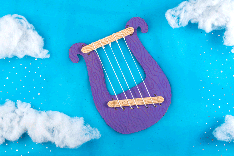 Animated GIF of a kid's Bible craft cardboard lyre being strummed with beads and glitter added with each pluck