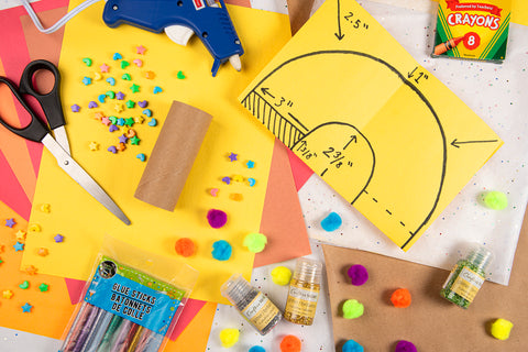 Overhead view of Mato & Hash Sunday school paper trumpet craft materials