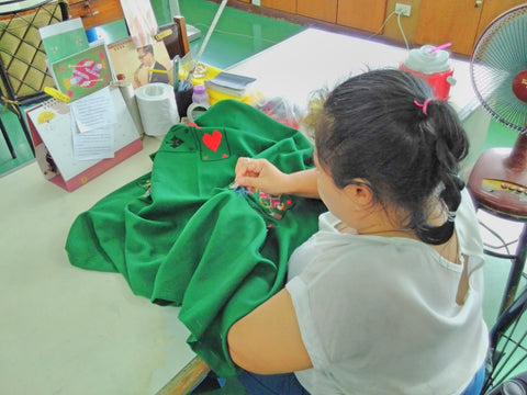 A lady embroidering a table cloth at the Good Shepherd Sisters Bangkok visited by Sabeena Ahmed june 2018