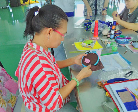 A lady artist embroidering and elephant on a cotton fabric - Good Shepherd Sisters Bangkok visited by Sabeena Ahmed June 2018