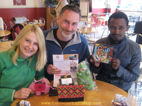 Christina Longden, Ian Agnew and Abiyot Sherifaw modelling fairtrade gifts with The Little Fair Trade Shop