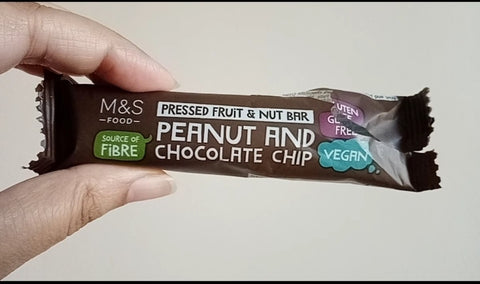 The Little Fair Trade Blog, Plastic Free July 21, Marks and Spencer Peanut and Chocolate Chip Pressed Fruit and Nut Bar in non recyclable packaging with Sabeena Z Ahmed